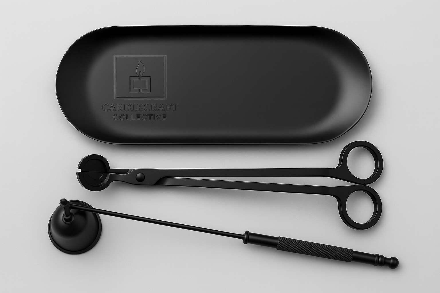 Black wick trimmer and a black candle snuffer and a black CandleCraft Collective oval tray, flat lay editorial image
